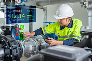 Industrial worker viewing guided work information on a tablet